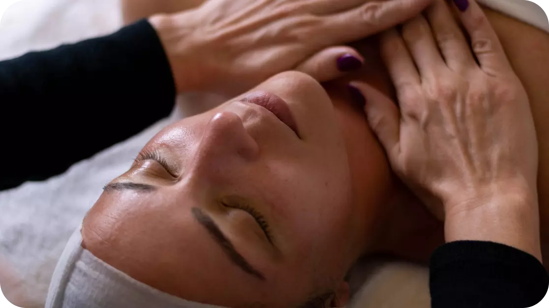 the girl is being massaged on the neck