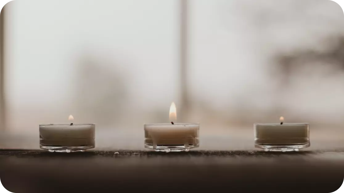 there are three burning candles