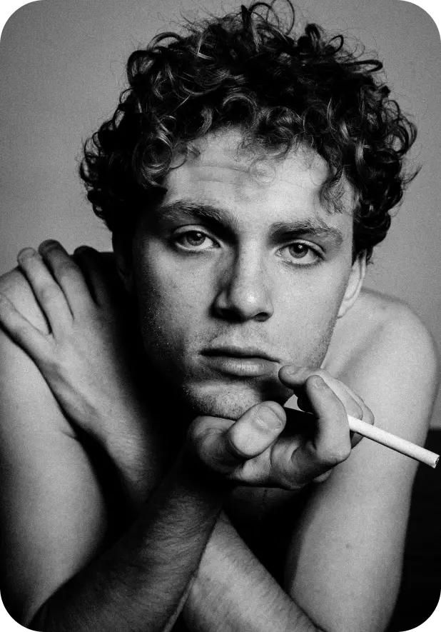 a guy holding a cigarette