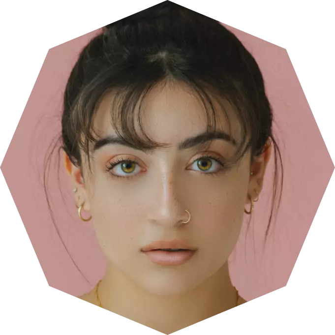 a girl with black hair with a nose ring