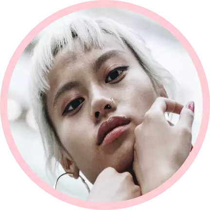 a girl with blond hair and a short haircut