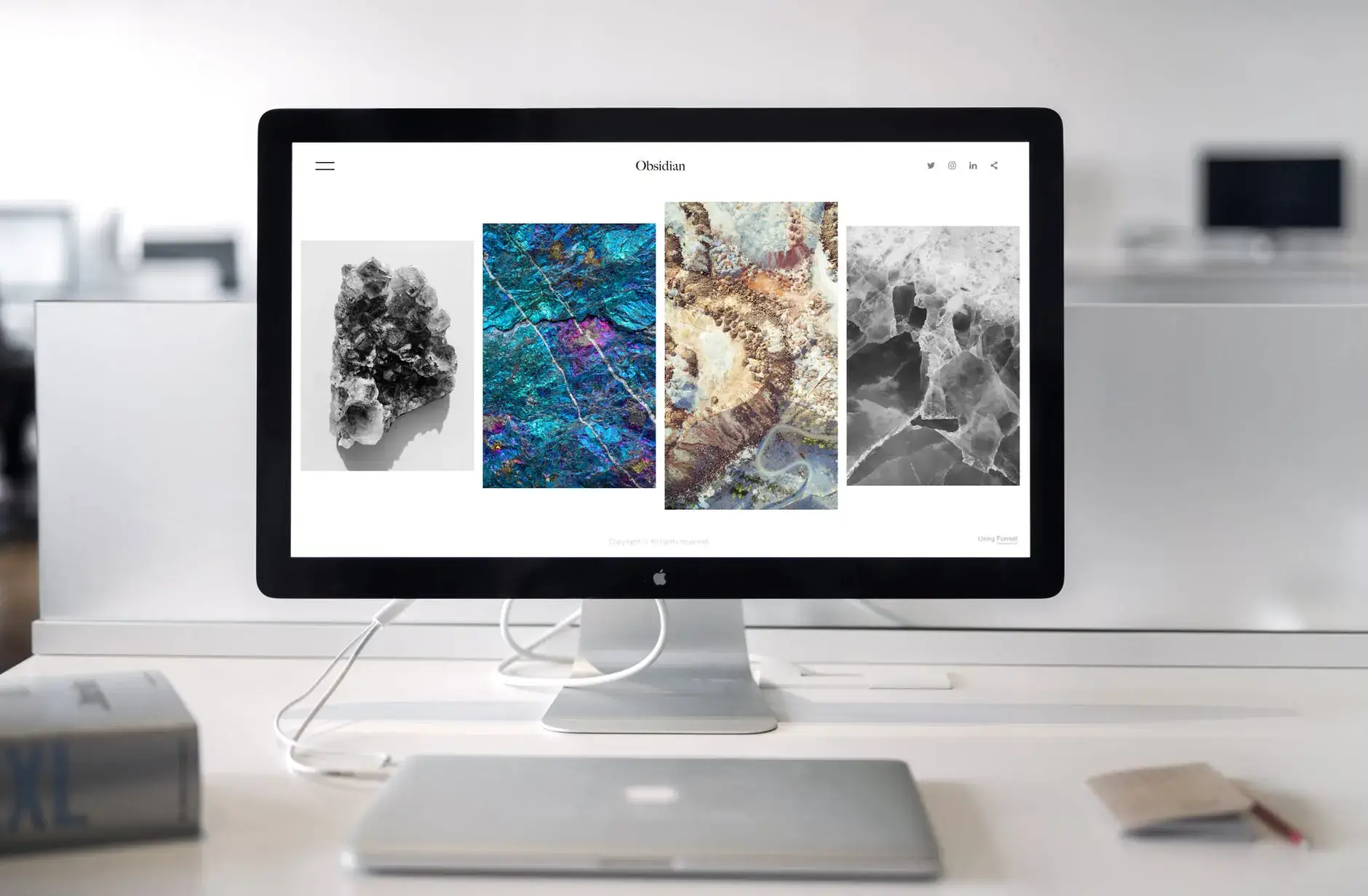 Website open on white macbook