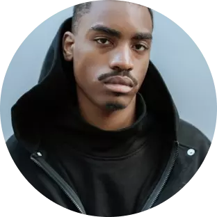 a black guy in a monk's jacket