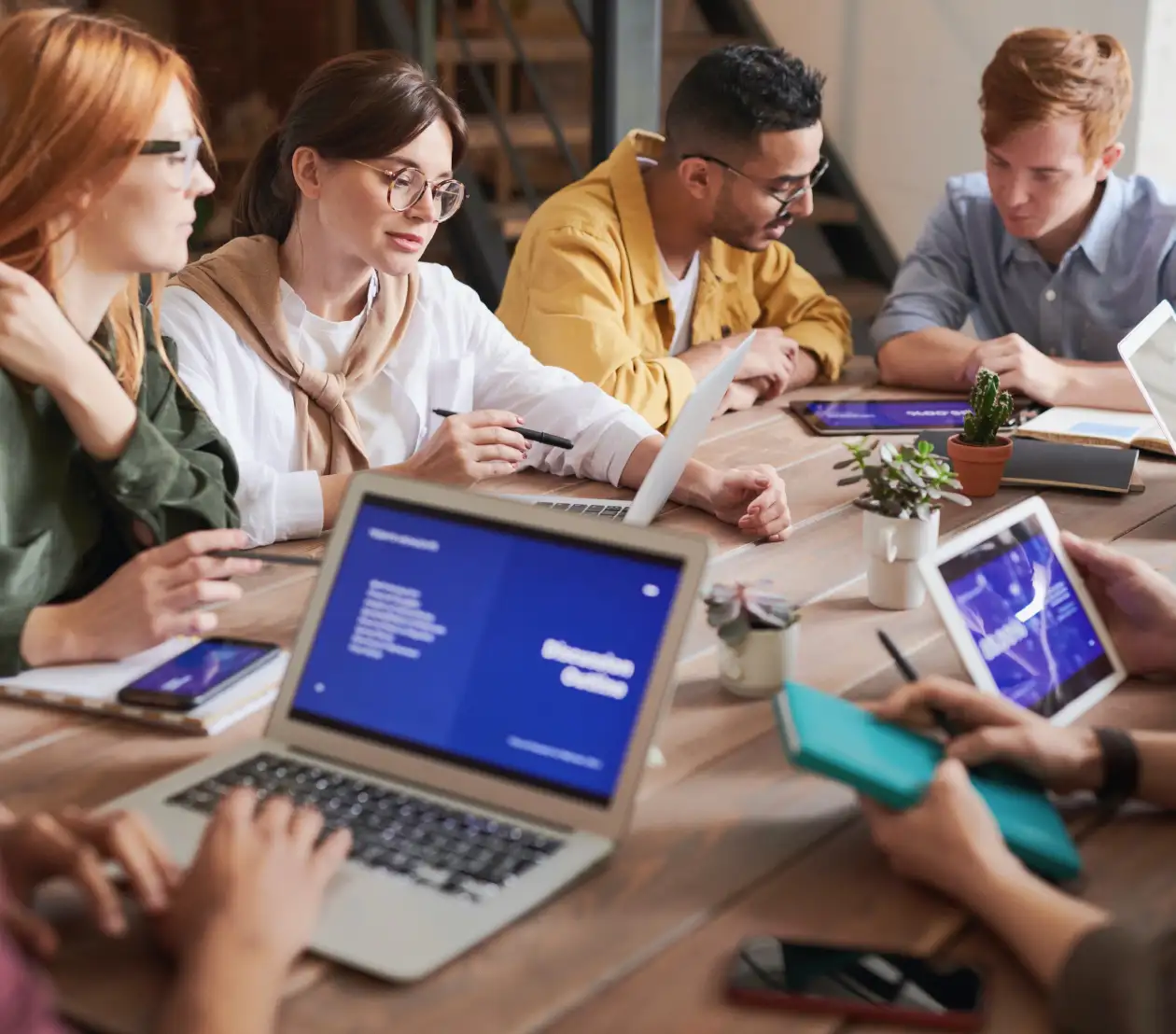 a group of people working and discussing together