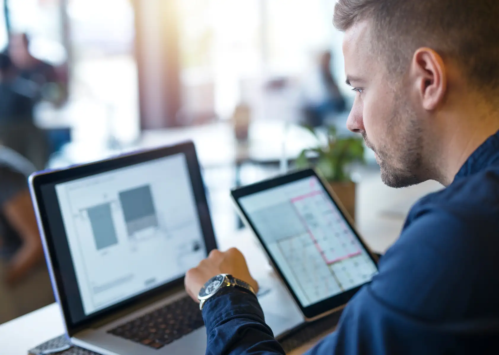 Young man at work is creating ecommerce on BOWWE website builder