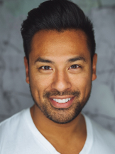 a man in a white T-shirt and a beard