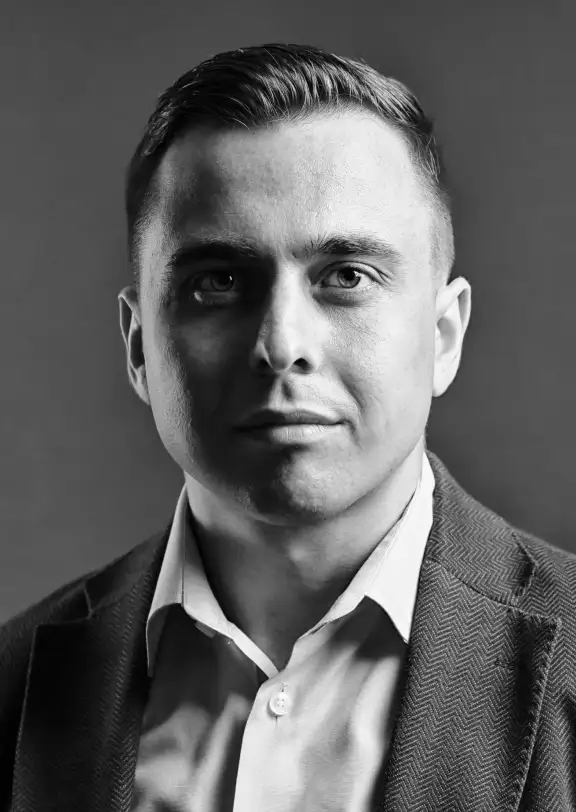 a guy in a shirt and jacket