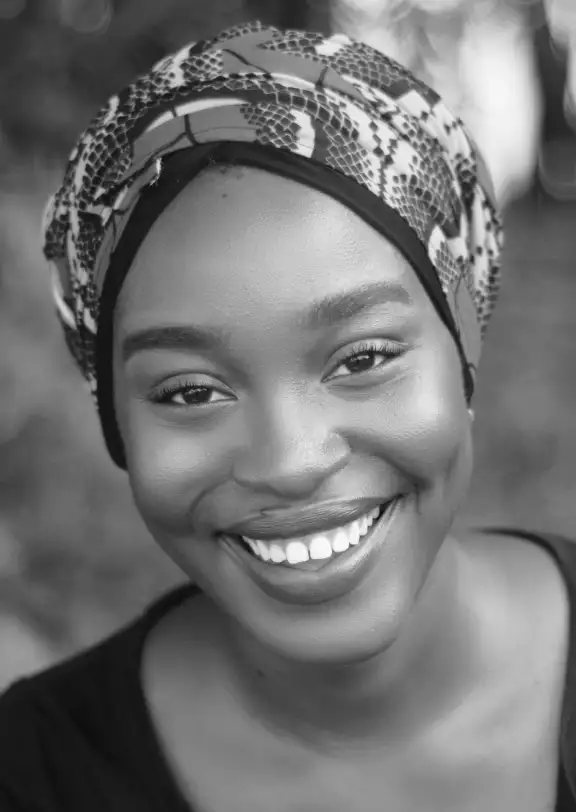a girl with a scarf on her head