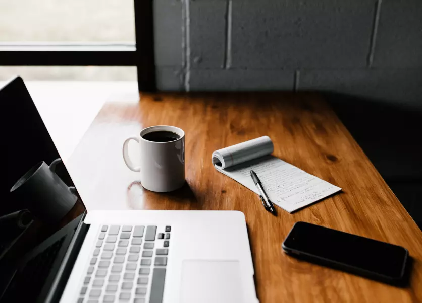 coffee and a laptop on the table 