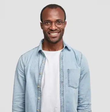 a man with glasses and a short haircut