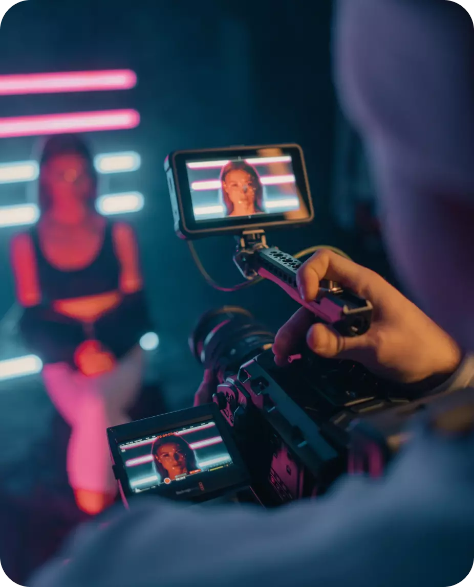 the girl is sitting and being photographed