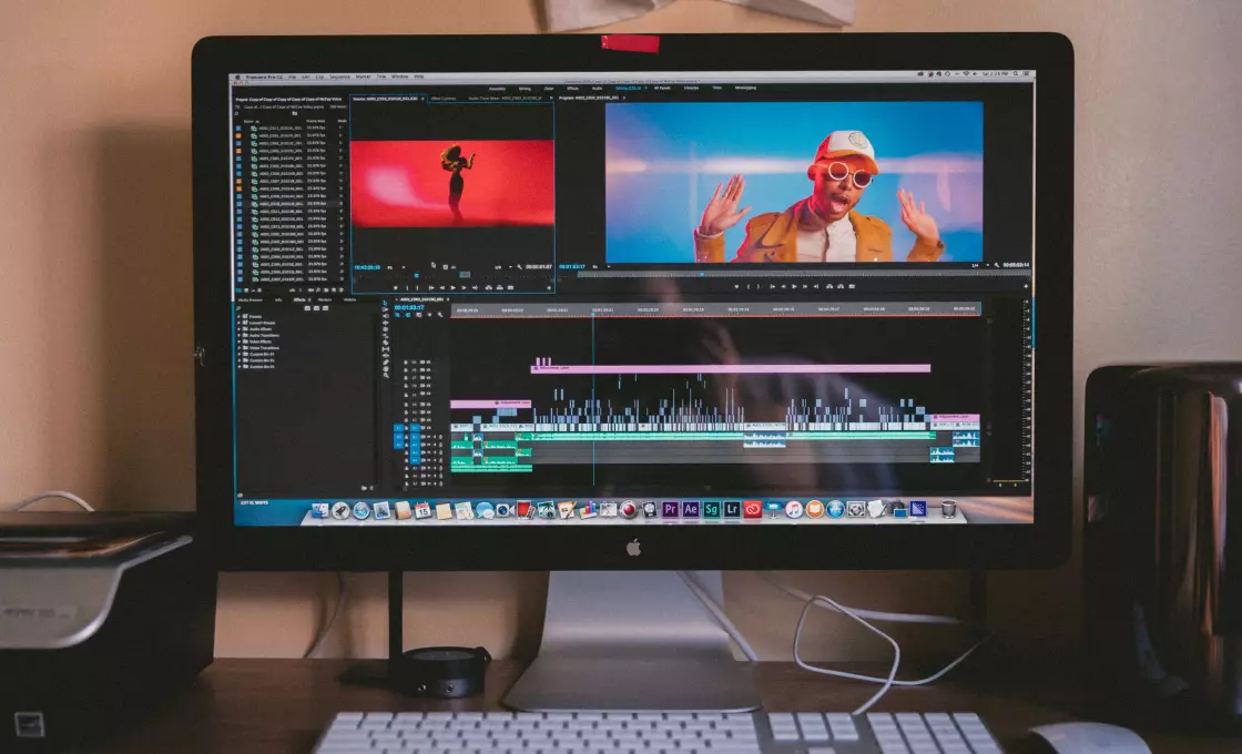 there is a monitor and keyboard on the table