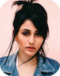 a hispanic woman with black hair and blue denim jacket