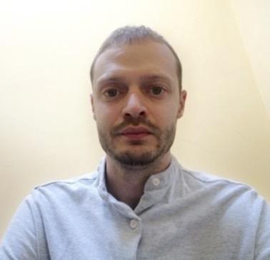 middle-age man in blue shirt