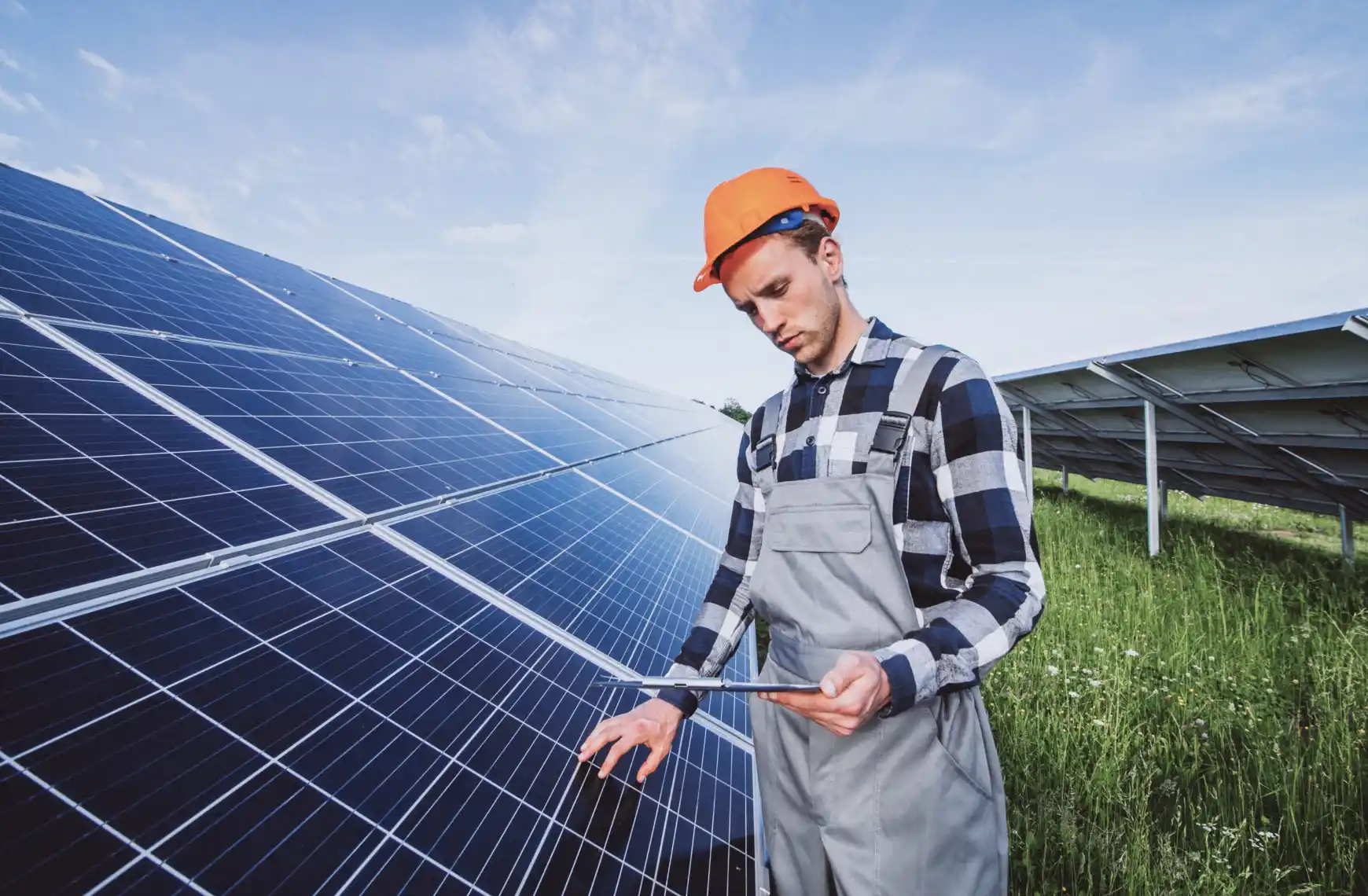 a man checks a solar panel