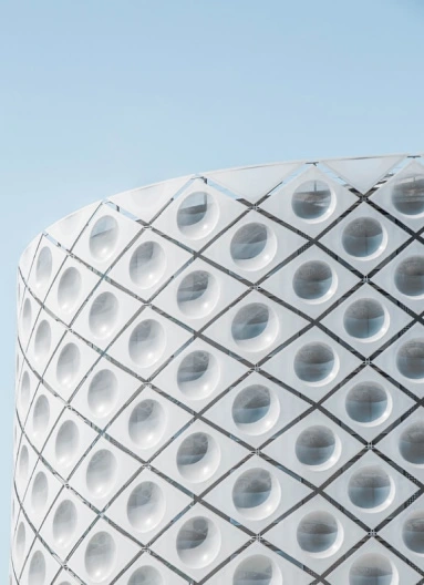 Modern grey building with simetrically situated round windows