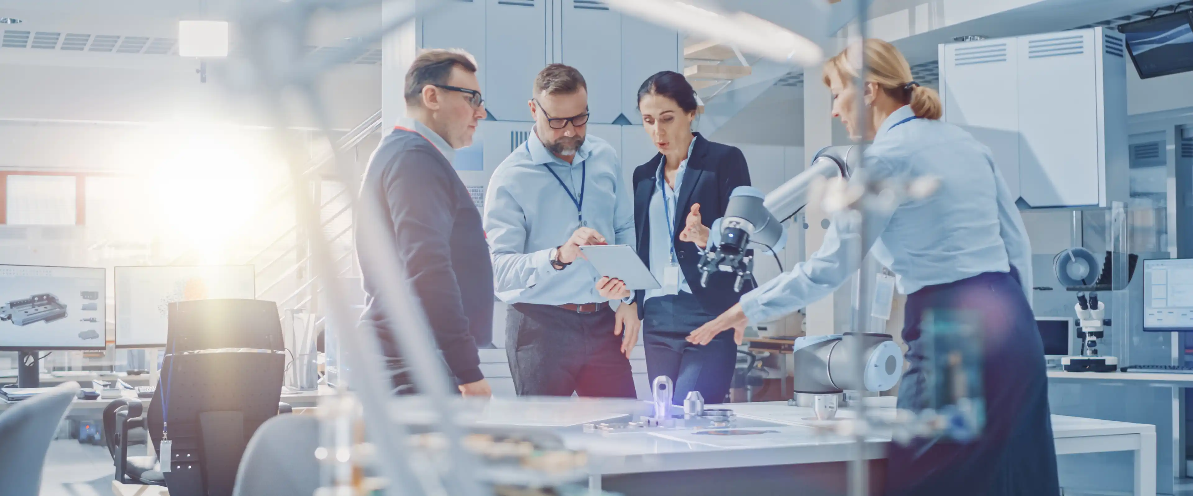 two men and two women are discussing work
