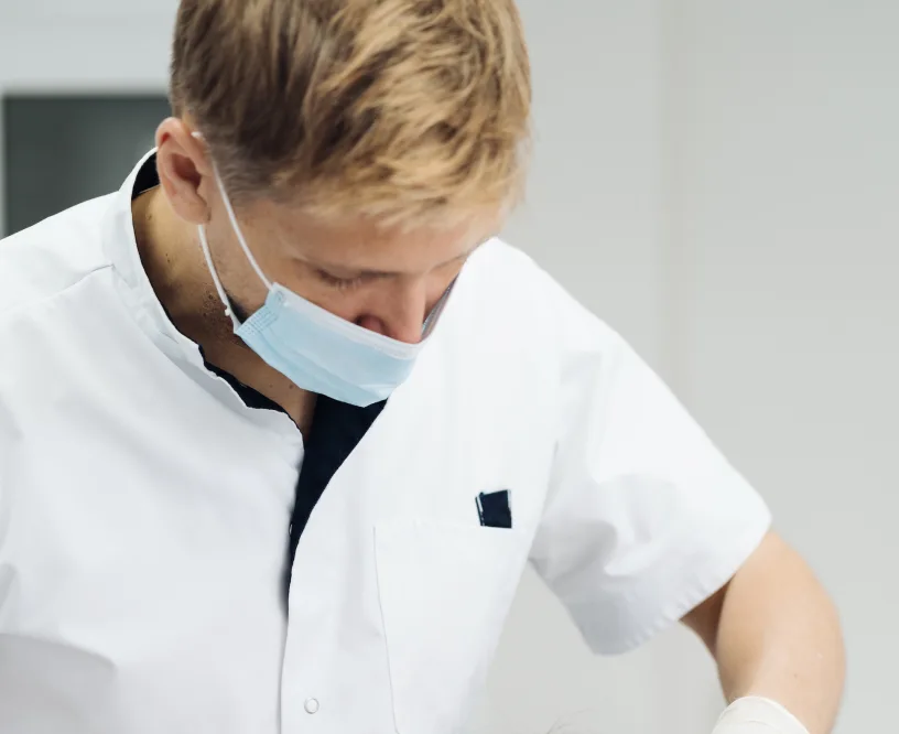 a doctor in a mask is working