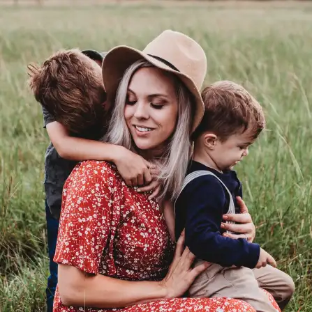a girl and two children with her