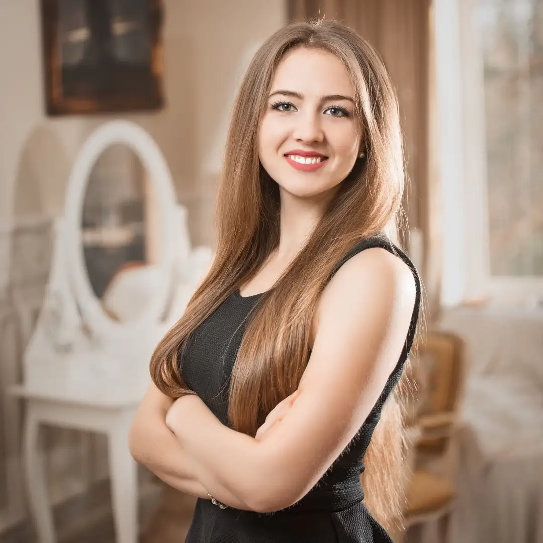 a girl in a black dress with blond hair