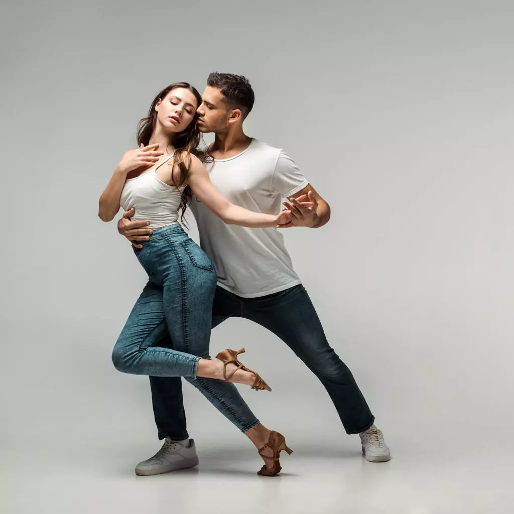 a boy and a girl dance bachata