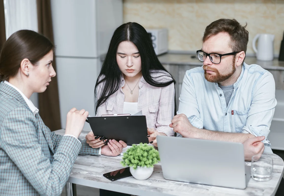 financial advisor showing a couple their income