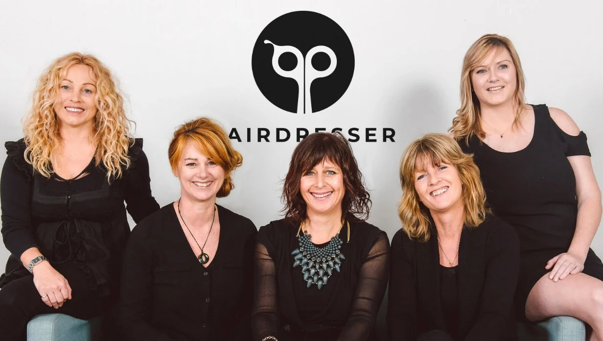 five girls on the background of the logo