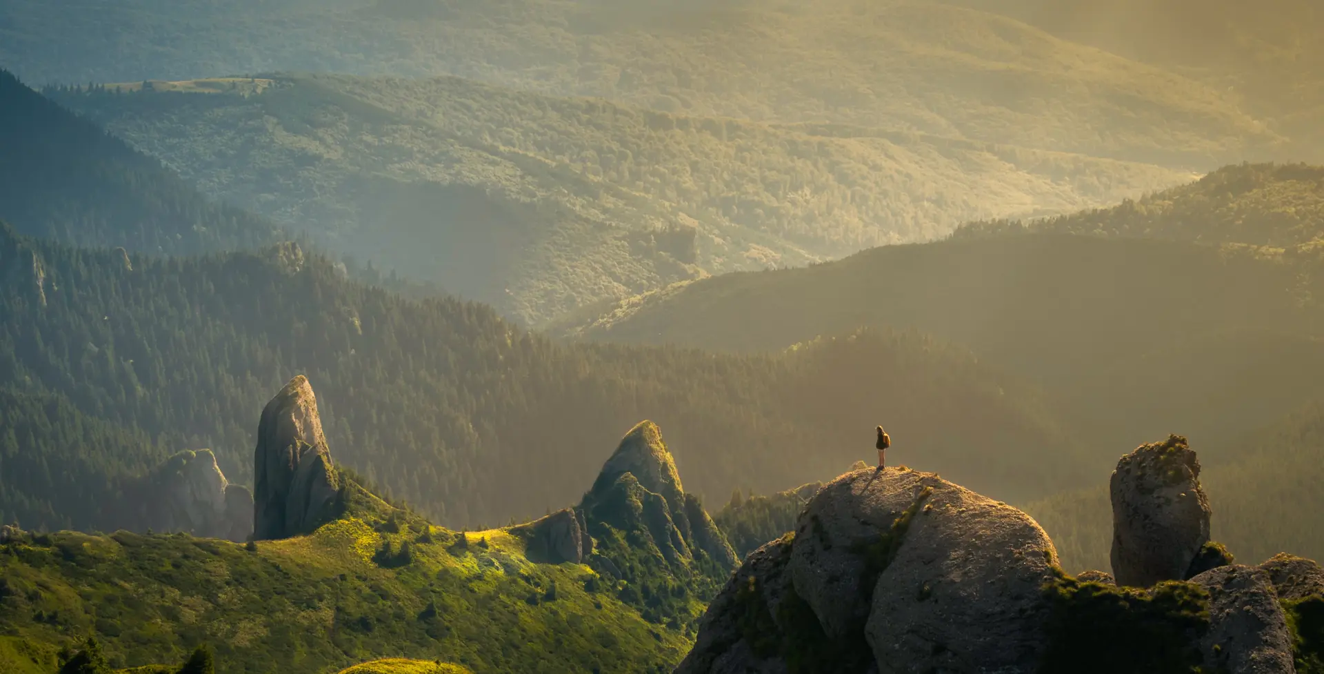a man stands on the mountain