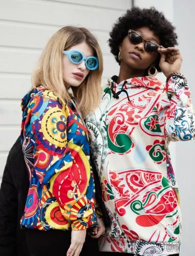 two girls in colored clothes