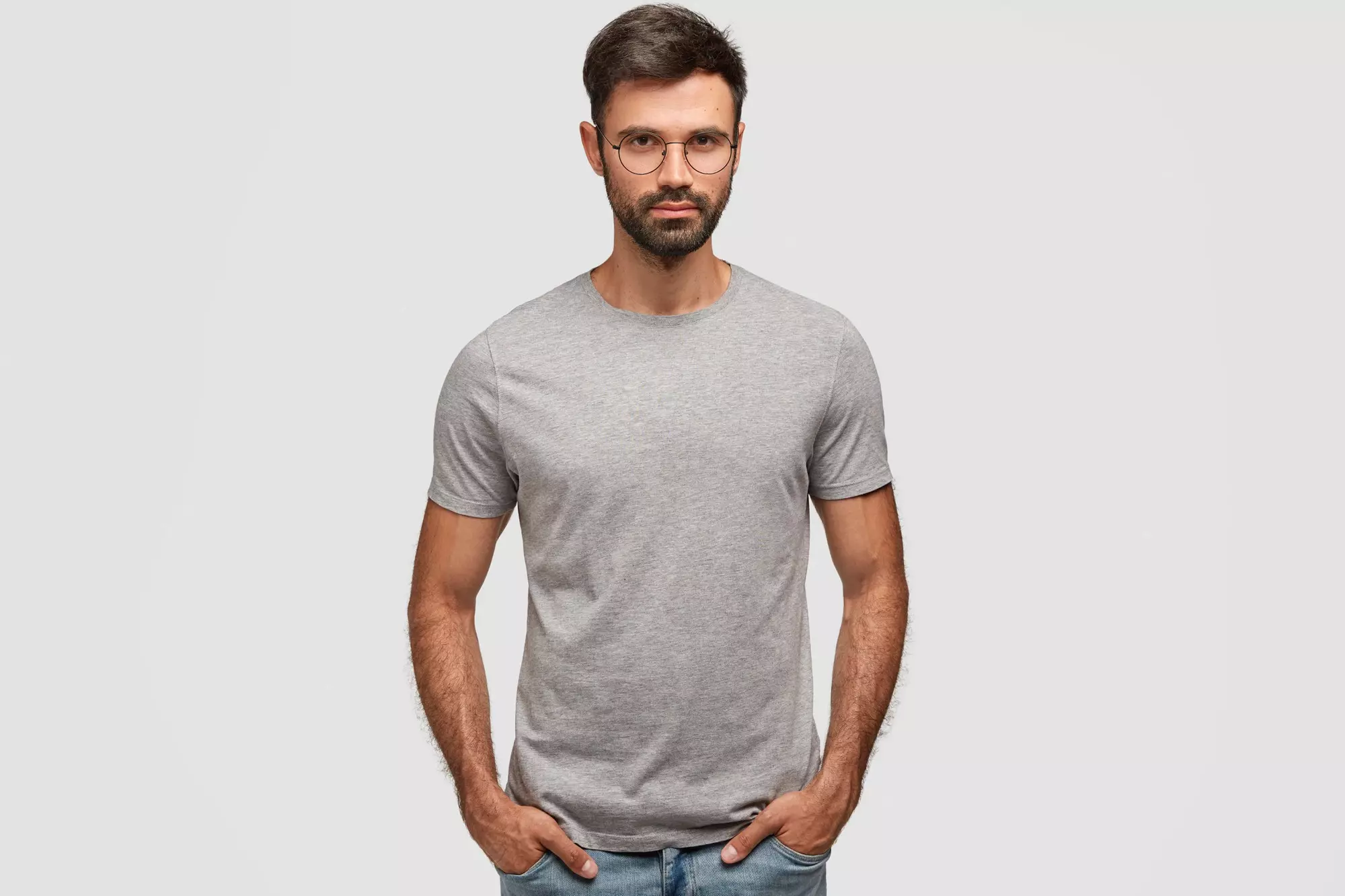 a man in a gray T-shirt and glasses