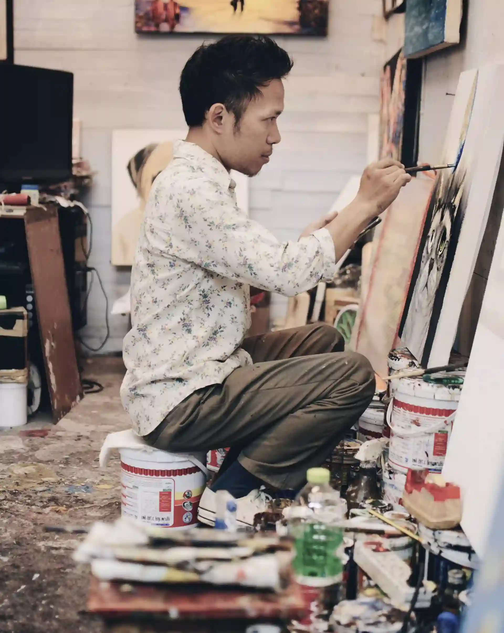 Man painting on canvas