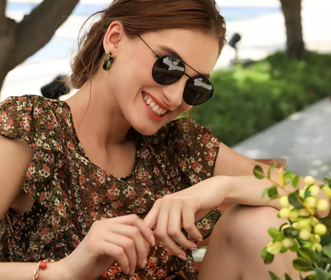 a girl in dark glasses