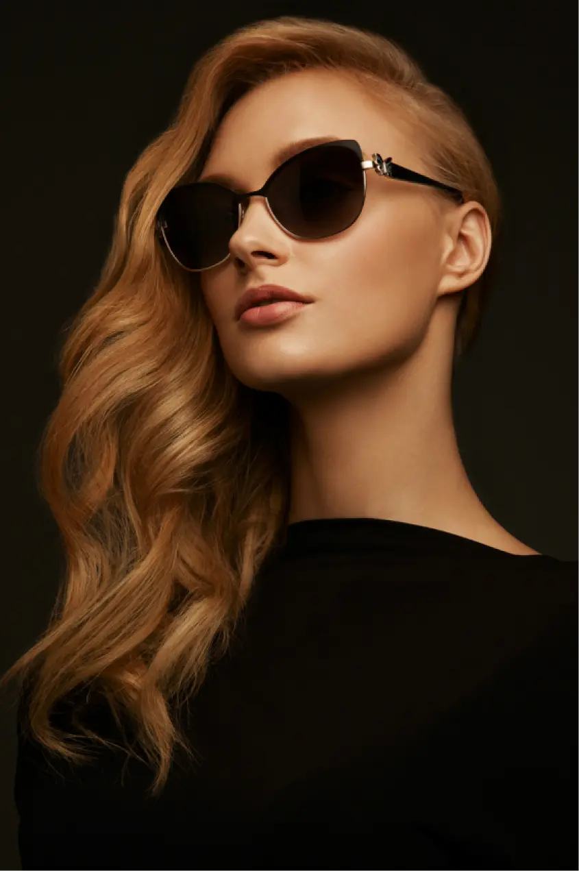 a girl in black clothes and glasses
