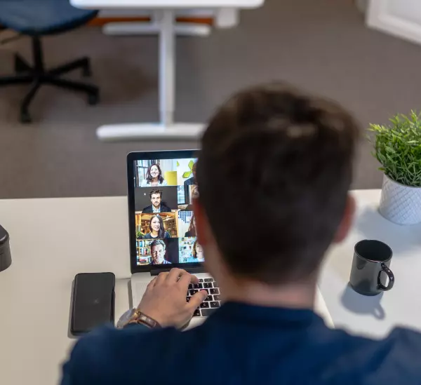 a man works at a laptop