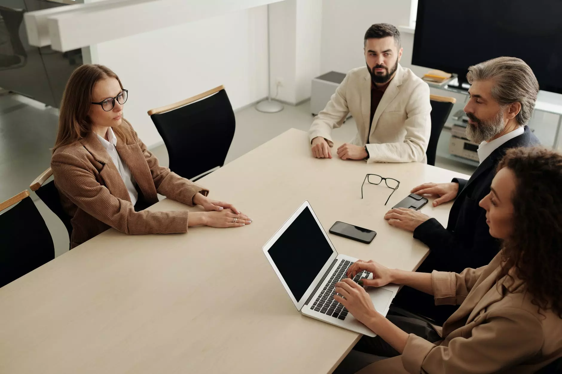 colleagues sit at the table and communicate