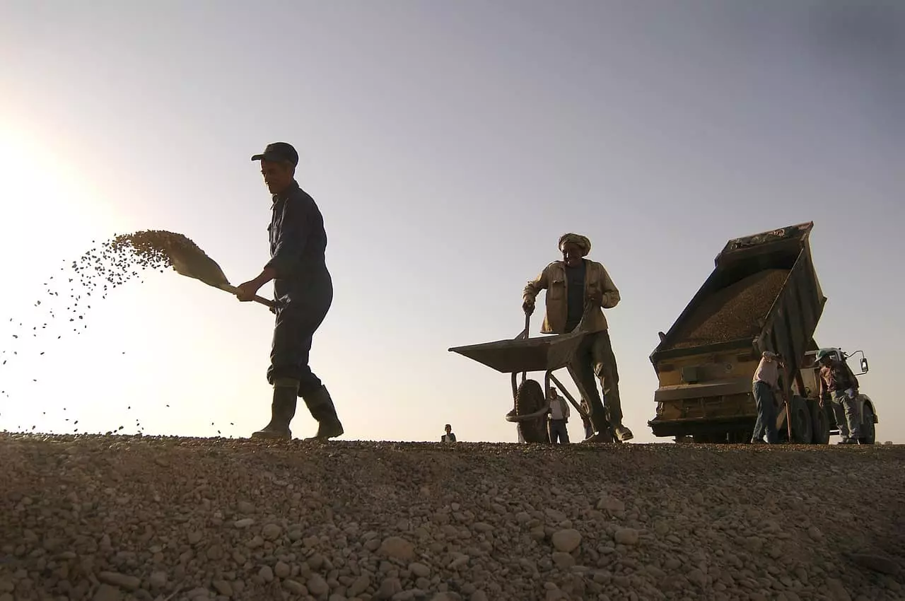 Men gathering stones