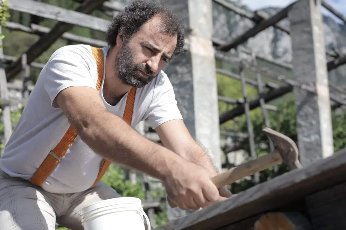 A man holds milk in his hand
