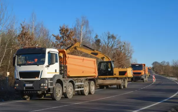 a truck is loaded by a tractor