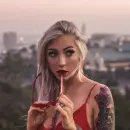 a girl with a tattoo on her arm