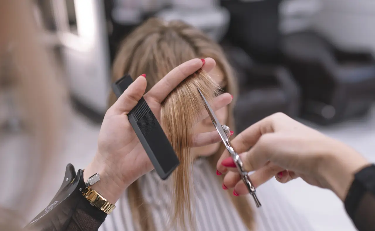the girl's hair is cut