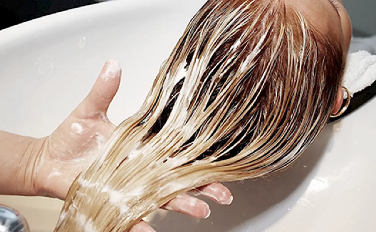 the girl's hair is washed