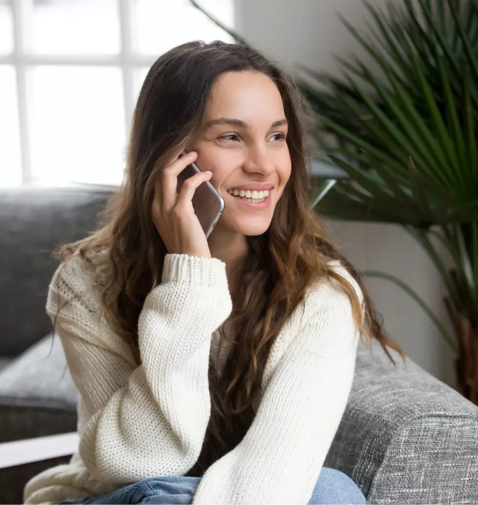a girl is talking on the phone