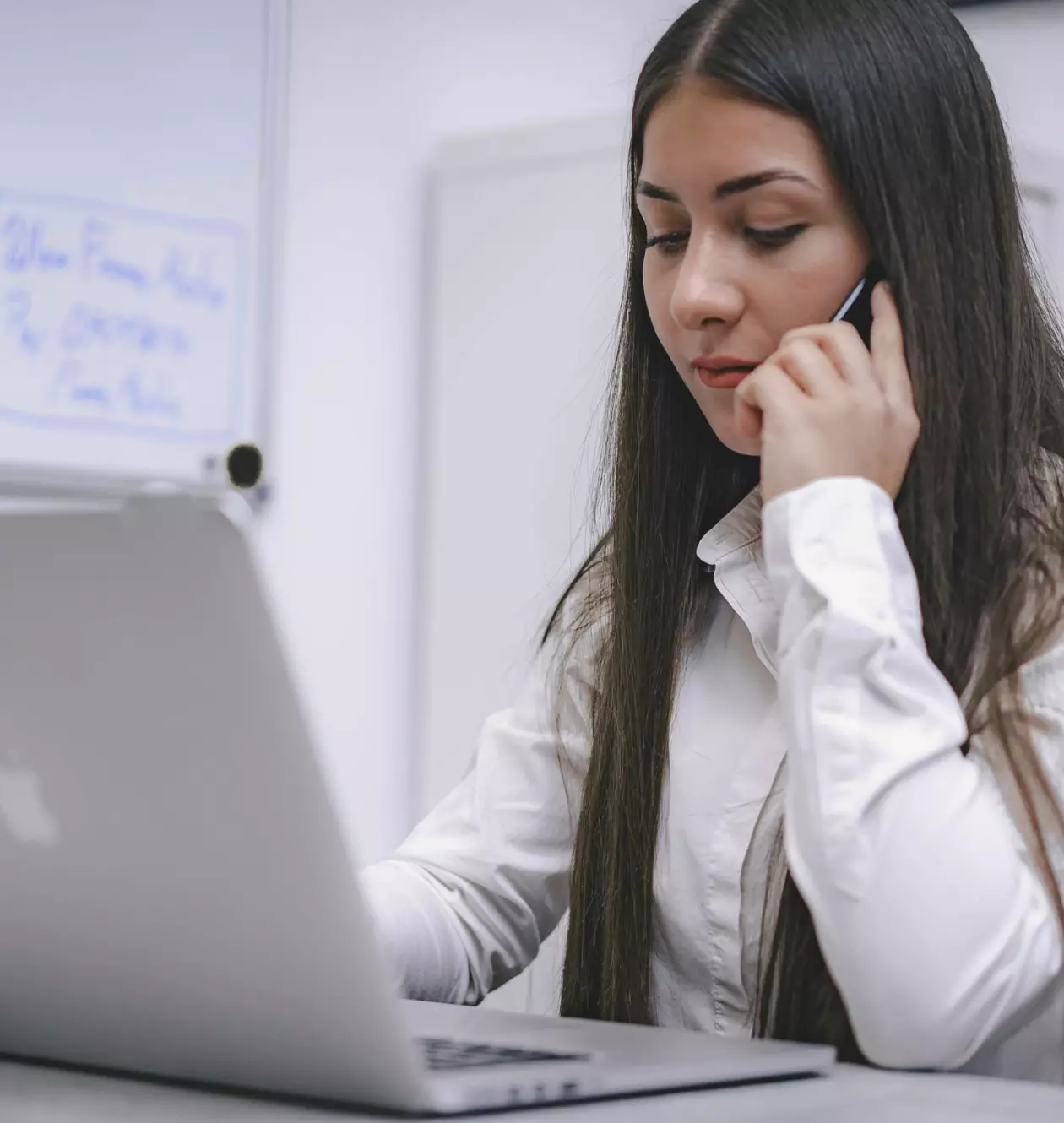 a girl with a laptop talking o