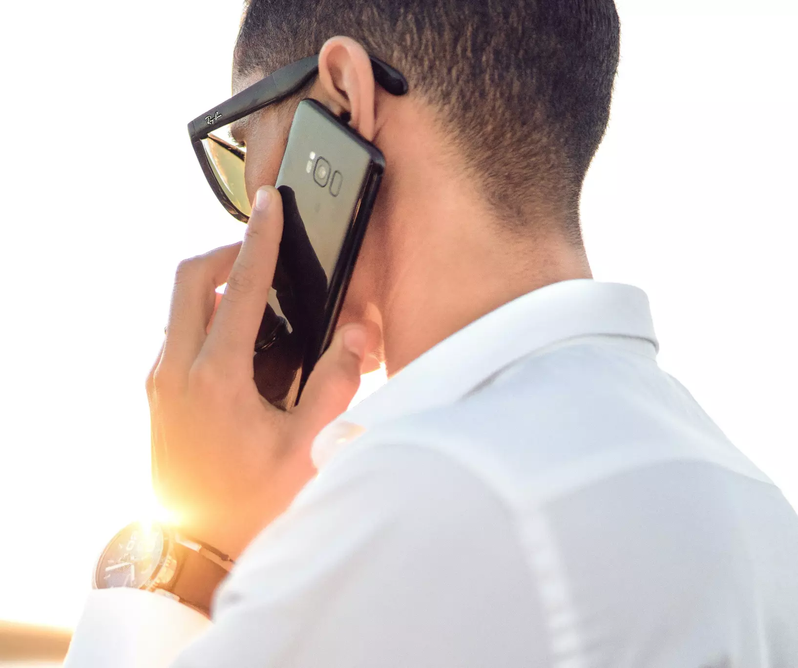 a man is talking on the phone