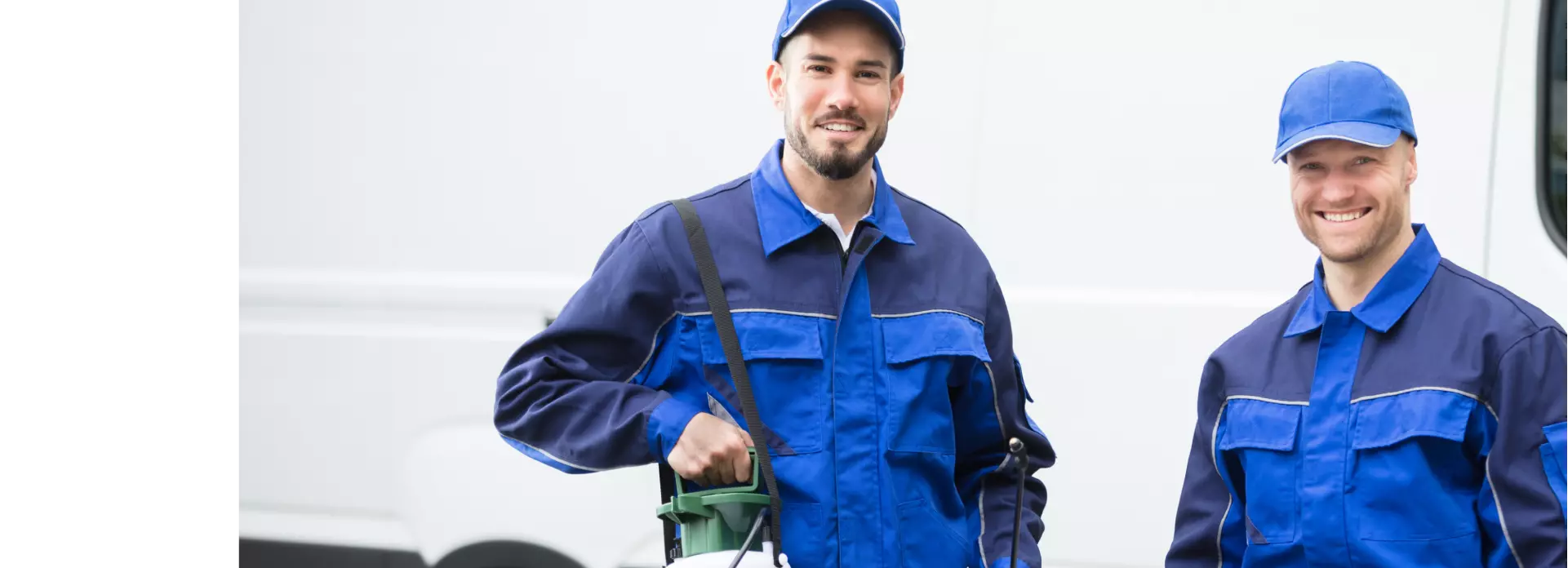 two men in blue work suits