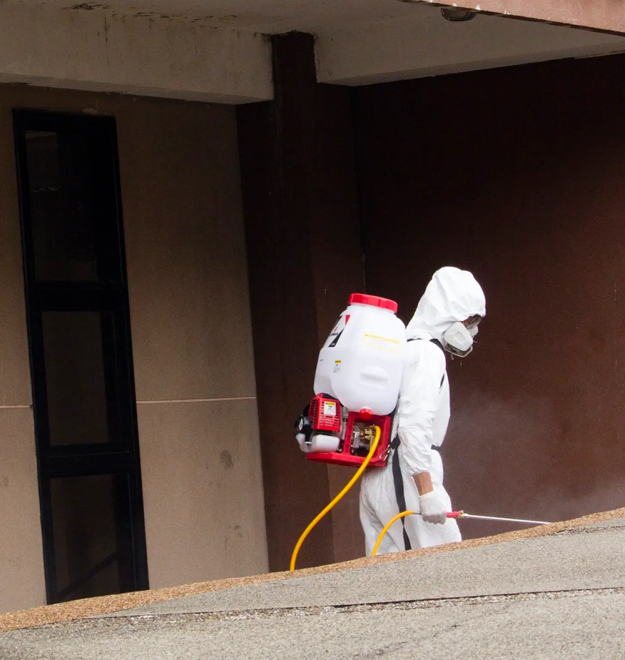 a man in a white protective suit