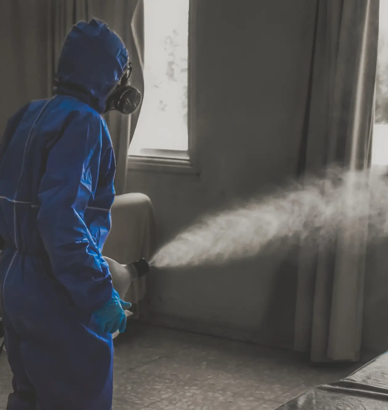 a man in a blue protective suit