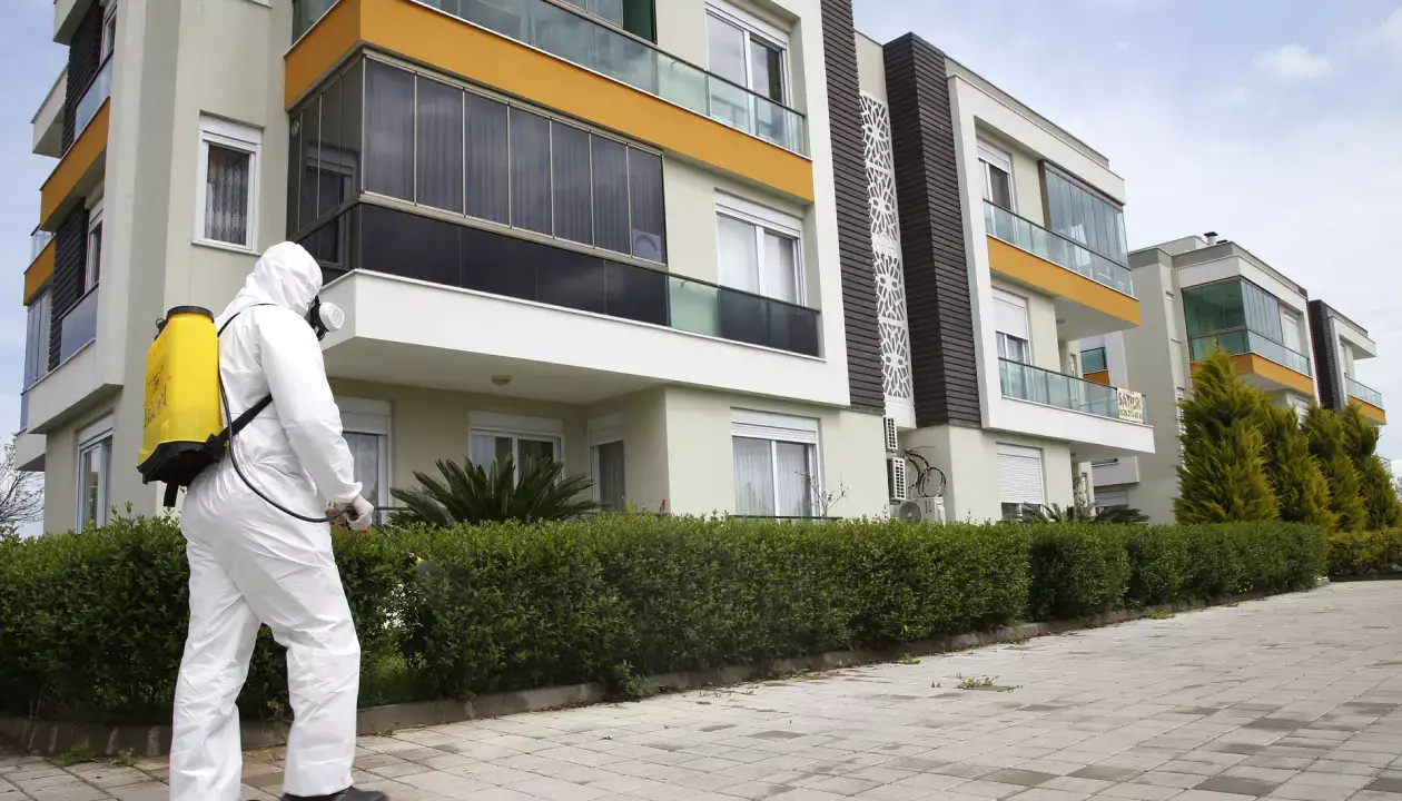 a man in a white protective suit