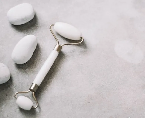 facial massager with white stone