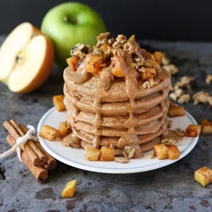 Apple pie pancakes with caramel sauce and walnuts